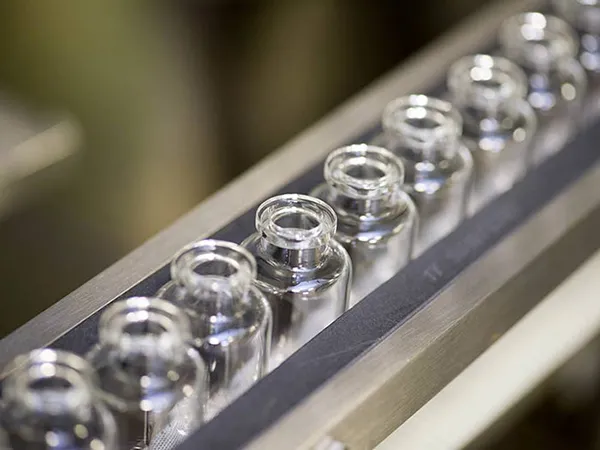 Vial filling and closing machines
