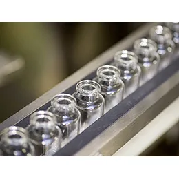 Vial filling and closing machines