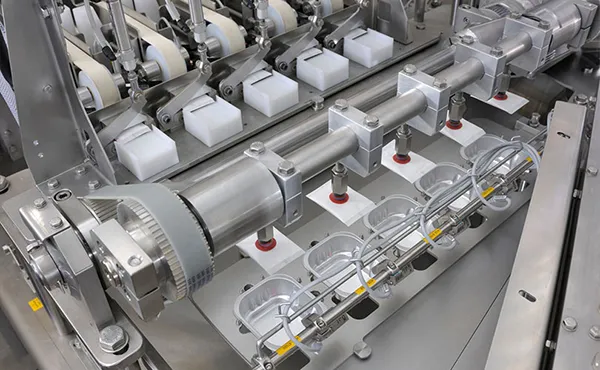 FILLING AND SEALING MACHINES